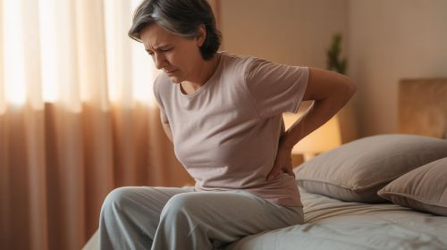 Person with sore lower back experiencing chronic pain